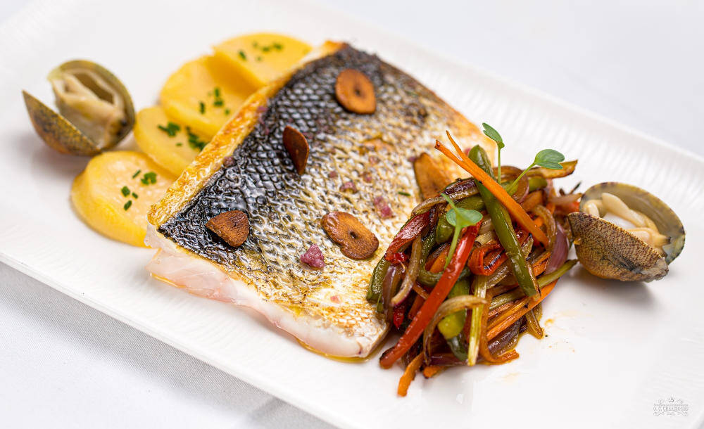 Oven-baked sea bass with vegetable stir-fry